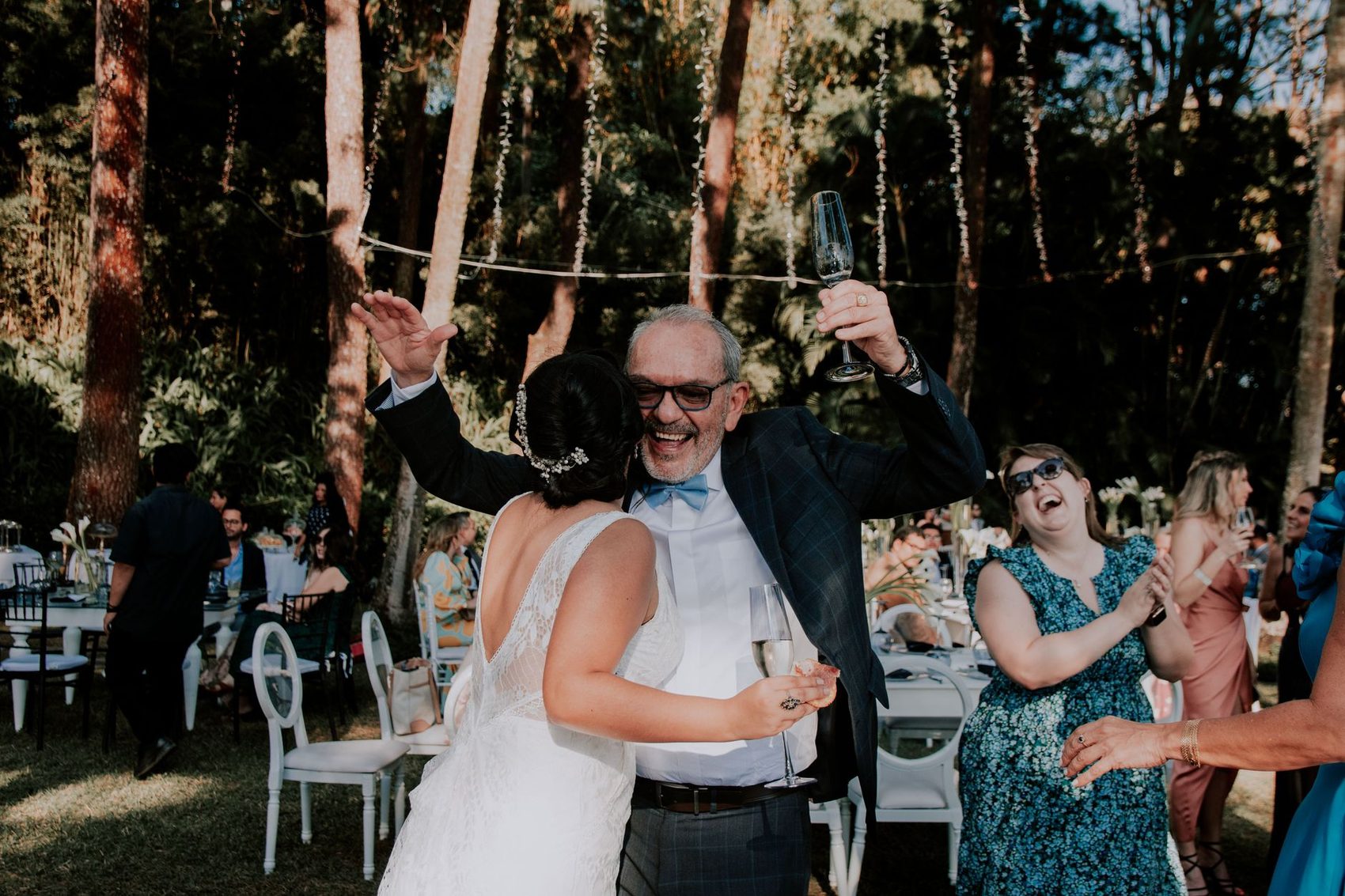 Guests celebrating under the trees