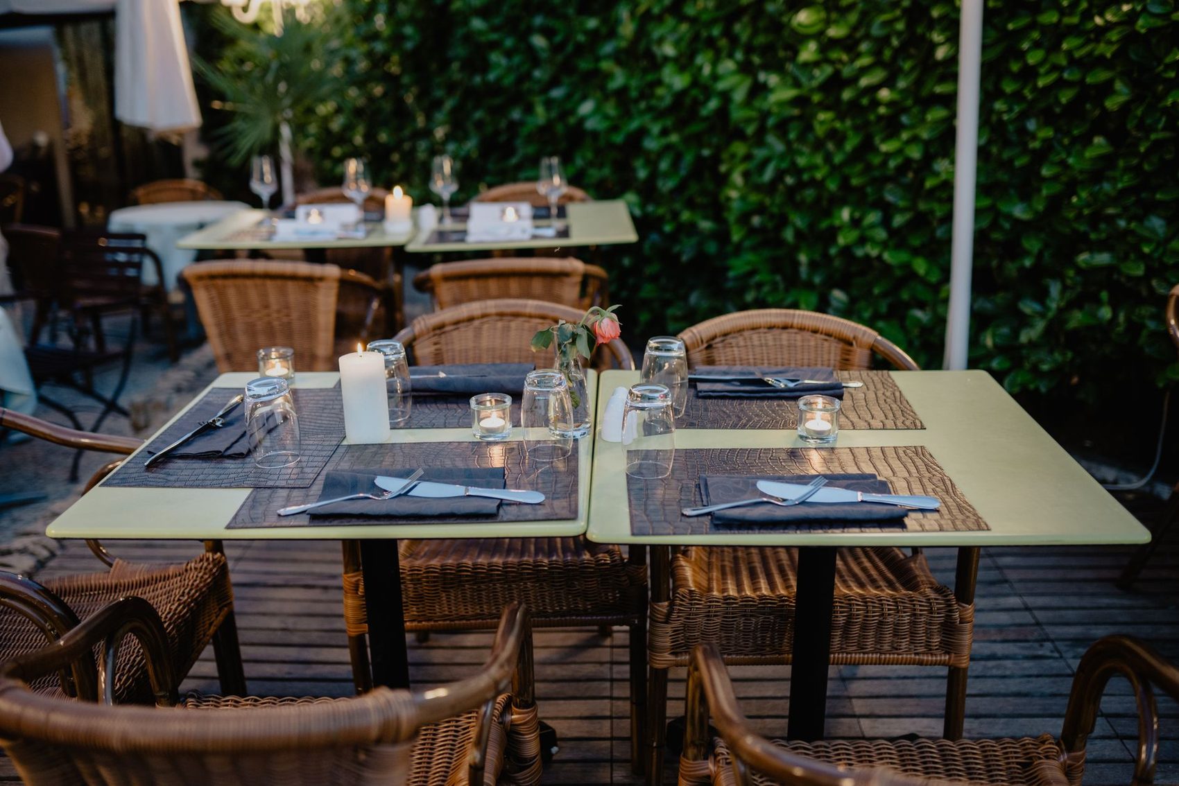 Table set outdoors under greenery